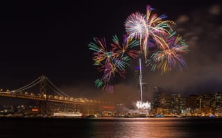 Fireworks at the San Francisco waterfront with the Golden Gate Bridge in the background