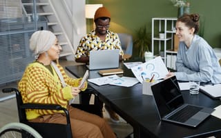 Photo of three marketing professionals at work.