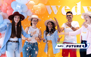 Wedy staff toss confetti in the air