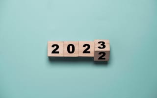 Four wooden number blocks, spelling out 2022 turning into 2023.
