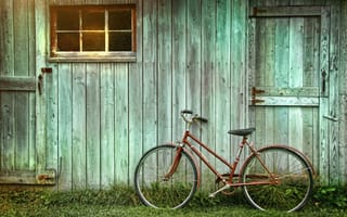 An image of a rustic bike shed.