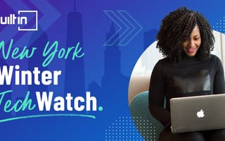 A woman sits with a laptop in front of an abstract design and the New York skyline