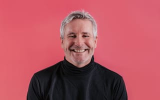 Zappi co-founder and CEO Steve Phillips is pictured against a pink background.
