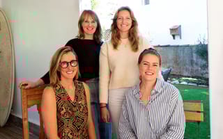 The four members of Beni's executive team pose together for a photo indoors.