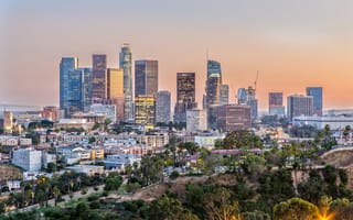 The downtown Los Angeles skyline during sunset.