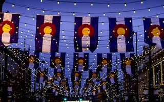 Colorado flags hanging over Larimer Square