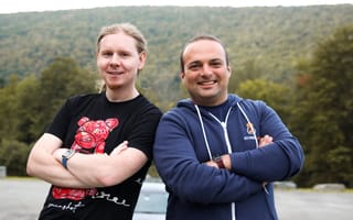 AtomicJar co-founder Sergei Egorov, left, and Eli Aleyner stand shoulder to shoulder outside.