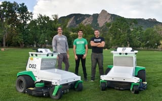 Scythe Robotics founders and the M.52 mower.