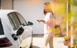 A person changing an electric vehicle.