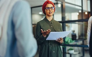 Photo of a business woman with a head wrap.