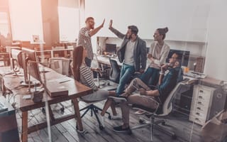 A sales team celebrates its wins together.