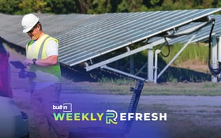 A Zeitview employee working on a job site near solar panels.