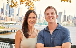 Marker Learning co-founders Emily Yudofsky (left) and Stefan Bauer (right) post for a photo in front of the NYC skyline.
