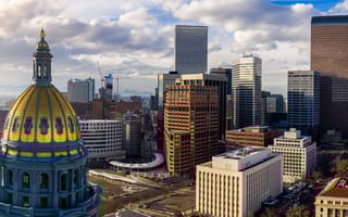 A view of the Colorado state capitol building and Denver skyline.