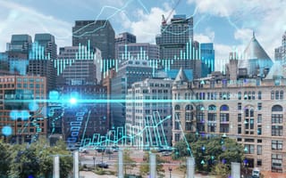 Finance and trade graphs and superimposed over a photo of Boston.