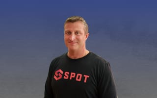 Spot co-founder Andrew Elsener against a blue and grey background.