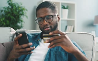 Photo of a man making an online purchase.