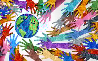 Dozens of paper hands in different colors, all reaching to surround the earth.