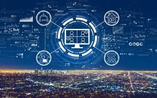 A landscape view of DTLA at night with graphics showing virtual connections and social networks.