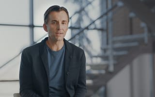 Qualtrics CEO Zig Serafin is pictured in an office.
