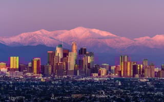 The Denver skyline with the Rocky Mountain in the background.