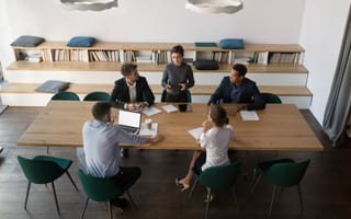 A manager leading a team meeting