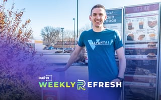 Rob Carpenter, CEO and founder of Valyant AI, stands against a restaurant's drive through box.
