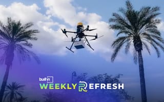 A Flyby Robotics drone flying in the sky between two palm trees.