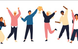 Six people celebrating with a trophy.