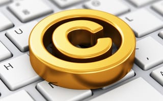 Gold copyright symbol on a computer keyboard