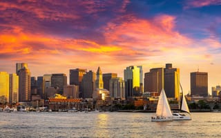 An evening photo of the Boston skyline.