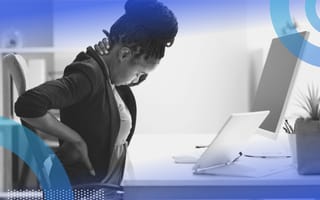 A woman stretching at a desk. Exercise and proper workplace hygiene can help prevent and relieve tech neck.
