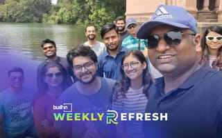 Members of the Stack Identity team pose for a group selfie outdoors.