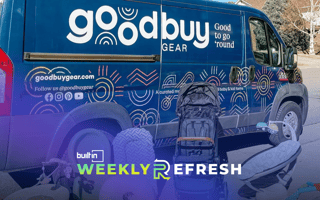 A parked van bearing the GoodBuy Gear logo.