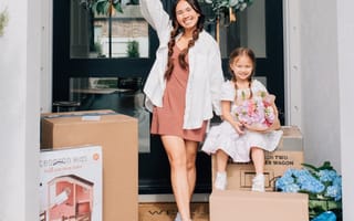 Woman and child on a porch with boxes