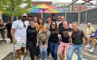 team outside wearing pride shirts