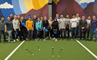 team at an indoor golf space
