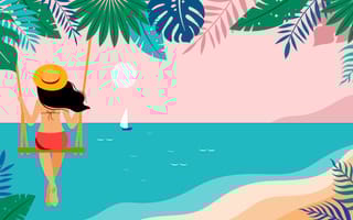 woman on a swing at sunset overlooking a tropical beach