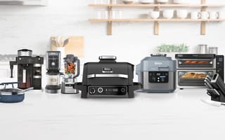 An assortment of Ninja kitchen appliances, including an air fryer, blender and coffee maker.
