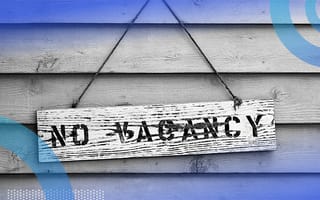 No vacancy sign hanging on a building