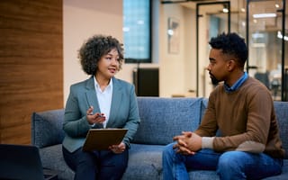 Financial advisor having a meeting with a client man in the office.