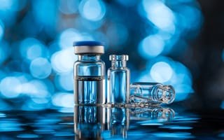 Glass vials for vaccine injection, to be filled in syringes for medical treatment.