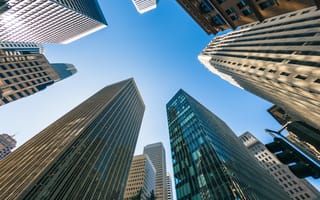 View of SF financial district skyscrapers from the group looking up as buildings tower overhead