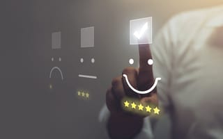 A person presses a smiley emoticon.