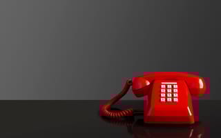 A red phone is pictured.