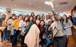Members of the Salesforce team take a group selfie.