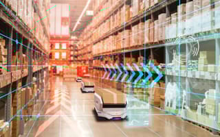 Robotic systems operate in a warehouse.