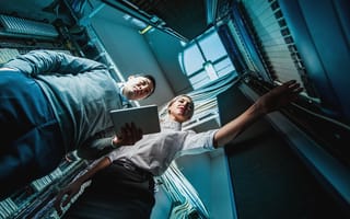 two people working in server room
