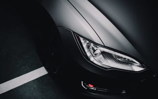 Part of a gray car is shown.