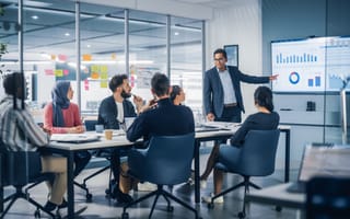 Company executives look over e-commerce data.